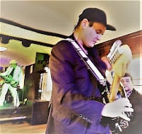Sammy Owen playing on guitar